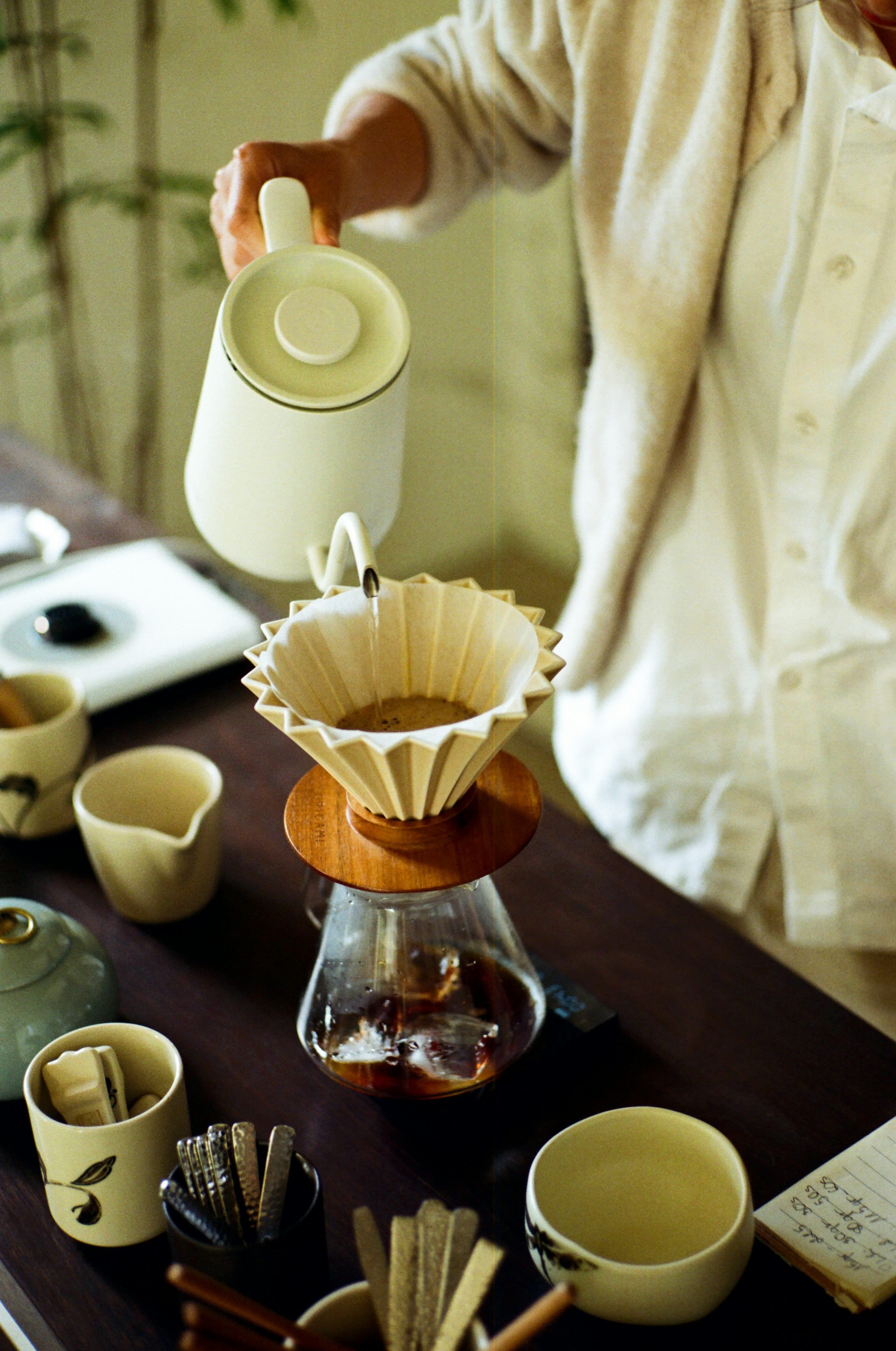 Hot water being poured into a coffee dripper.
